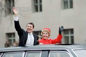 Reagans waving from limousine during inaugural parade