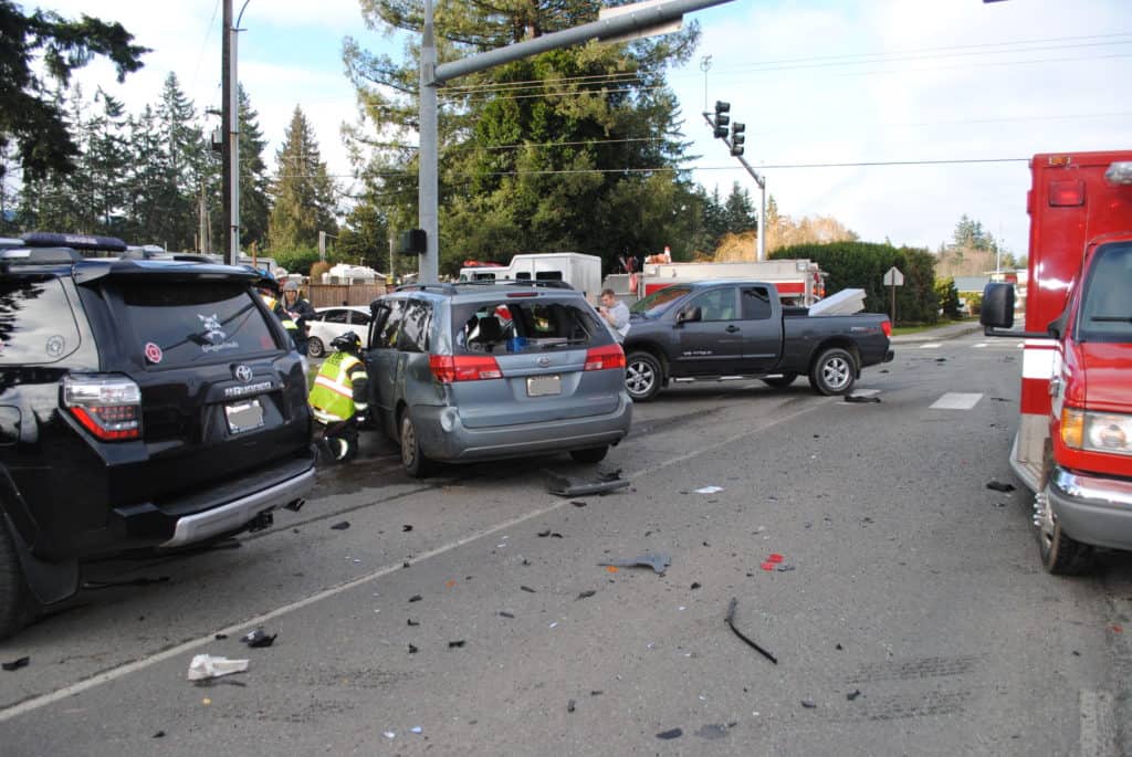 Red light crash van trucks intersection - Washington State- Coluccio Law