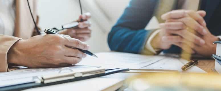 blog_contingency_fee_agreement Men reviewing documents