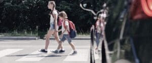 children walking in crosswalk