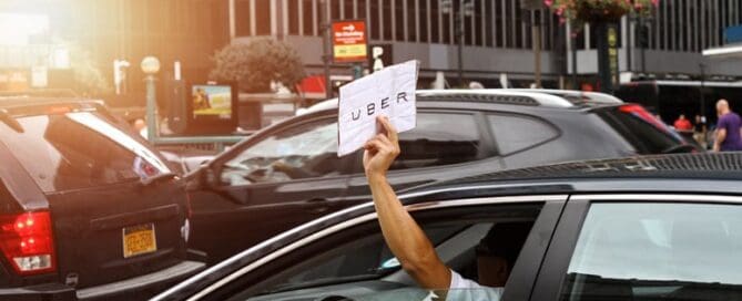 uber driver holding up sign