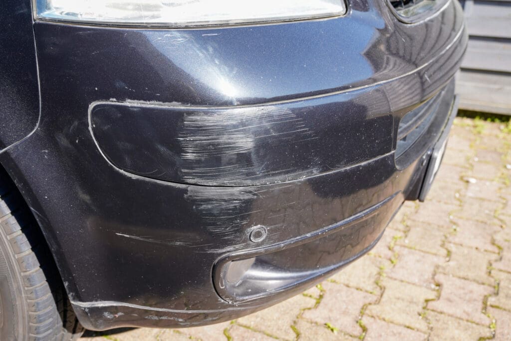 Parked van bumper damage