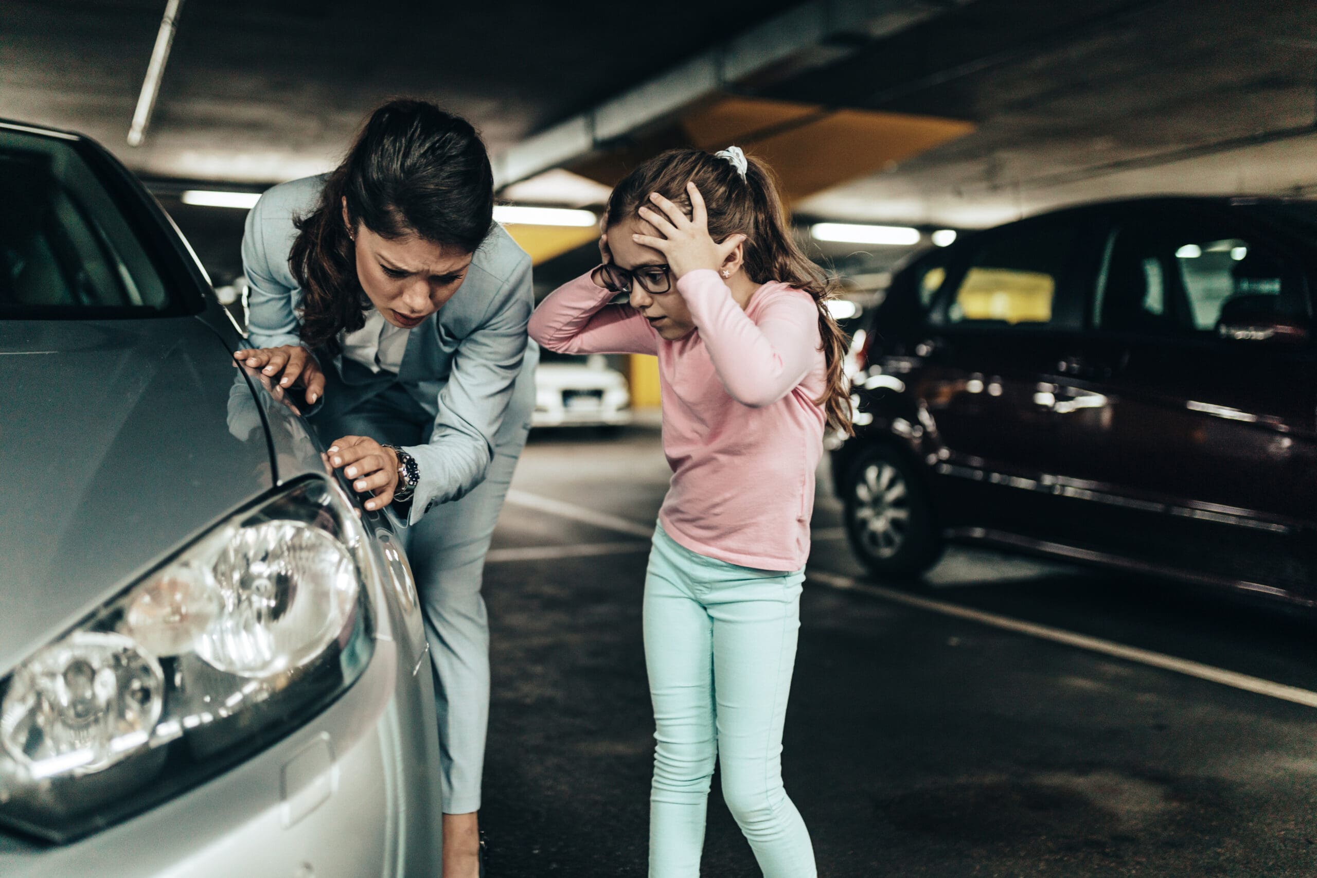 Mother and daughter frustrated at damage to parked car